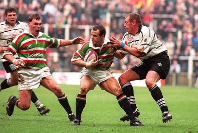 250197 - Leicester Rugby v Brive - Heineken Cup Final - Austin Healey of Leicester is tackled by Loic Van der Linden