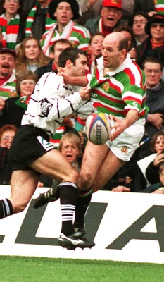 250197 - Leicester Rugby v Brive - Heineken Cup Final - John Liley is tackled by Sebastien Carrat