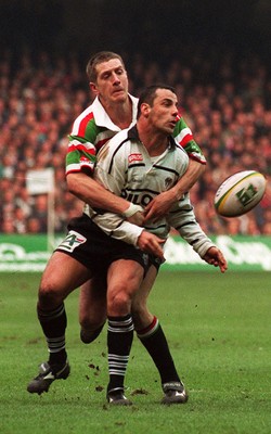 250197 - Leicester Rugby v Brive - Heineken Cup Final - Christophe Lamaison is tackled by Neil Back