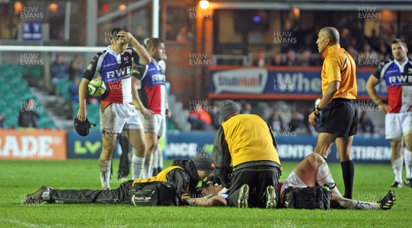 081113 - Leicester Tigers vs Ospreys - LV= Cup Round 1-Joe Rees of Ospreys lies injured as Sam Davies looks worried(c) Huw Evans Agency