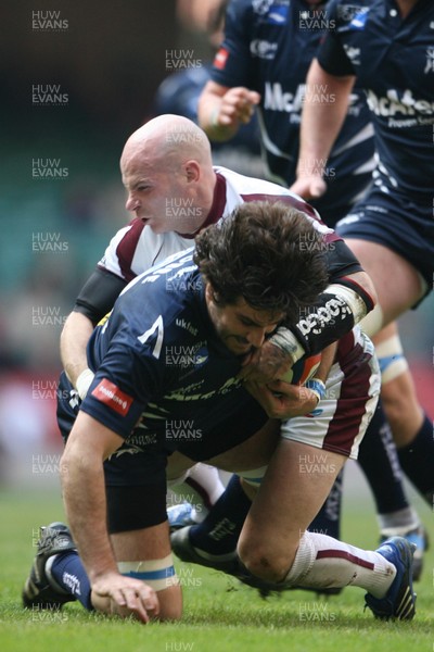 24.03.07 Sale Sharks v Leicester Tigers Sale's Juan Lobbe is tackled by Paul Burke 