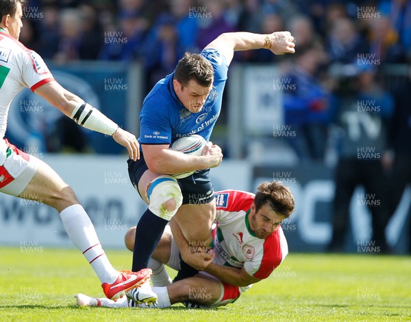 270413 - Leinster v Biarritz - Amlin Challenge Cup - Cian Healy of Leinster is tackled by Dimitri Yachvili of Biarritz 