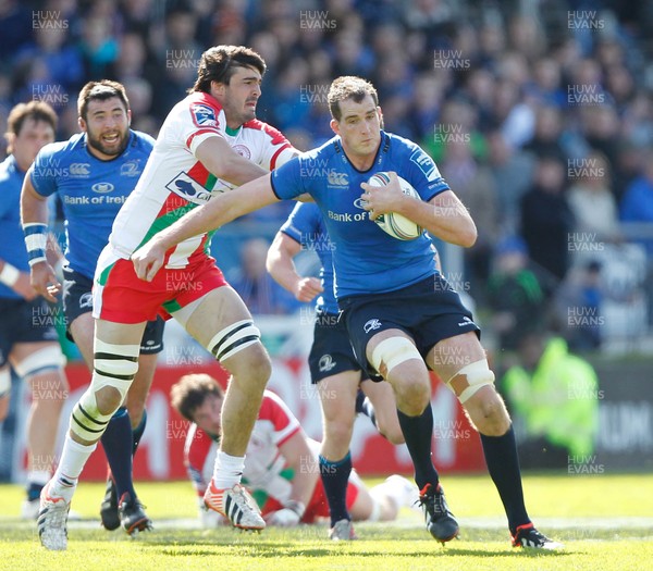 270413 - Leinster v Biarritz - Amlin Challenge Cup - Devin Toner of Leinster takes on Thibault Dubarry of Biarritz 