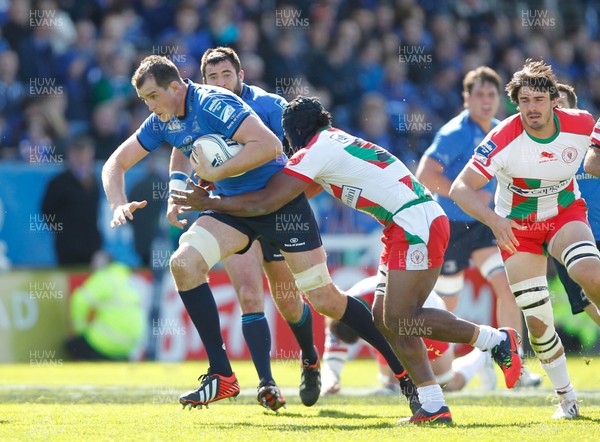 270413 - Leinster v Biarritz - Amlin Challenge Cup - Devin Toner of Leinster is tackled by Taku Ngwenya of Biarritz 