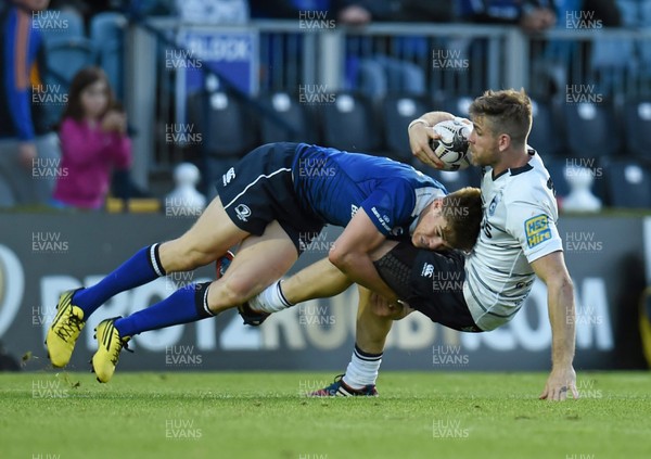 120915 - Leinster v Blues - Guinness Pro 12 - Gavin Evans, Cardiff Blues, is tackled by Garry Ringrose, Leinster