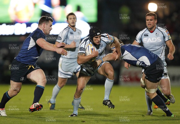 271012 Leinster v Blues - RaboDirect Pro 12 - Tom James of Cardiff is tackled by Cian Healy and Jamie Heaslip of Leinster 