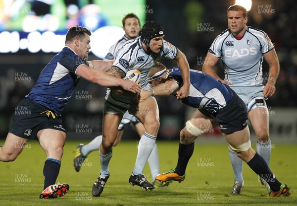 271012 Leinster v Blues - RaboDirect Pro 12 - Tom James of Cardiff is tackled by Cian Healy and Jamie Heaslip of Leinster 