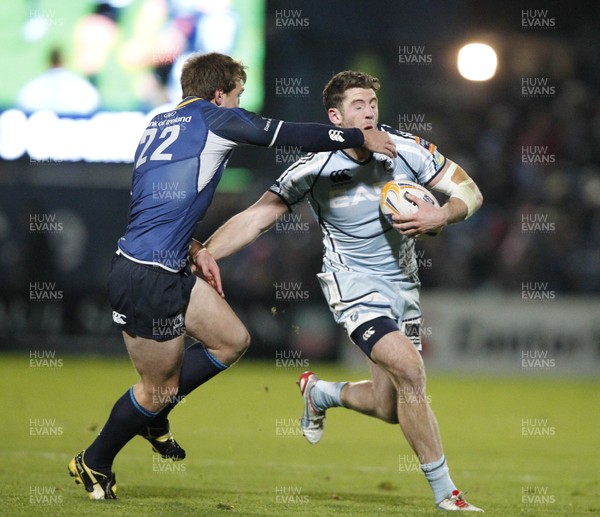 271012 Leinster v Blues - RaboDirect Pro 12 - Alex Cuthbert of Cardiff is tackled by Brendan Macken of Leinster 