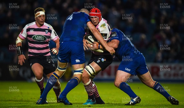 080917 - Leinster v Cardiff Blues - Guinness PRO14 -  Seb Davies of Cardiff is tackled by Devin Toner, left, and Cian Healy of Leinster