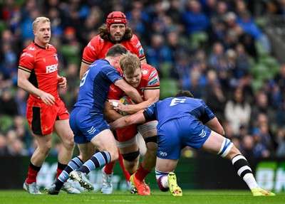 010325 - Leinster v Cardiff Rugby - United Rugby Championship - Josh McNally of Cardiff is tackled by Luke McGrath and Max Deegan of Leinster