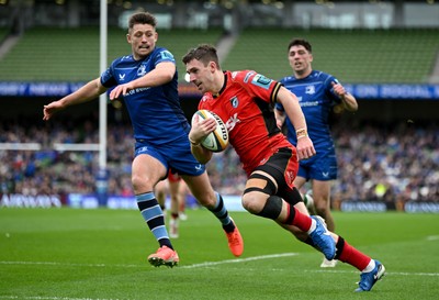 010325 - Leinster v Cardiff Rugby - United Rugby Championship - Harri Millard of Cardiff scores his side's first try despite the efforts of Ross Byrne of Leinster