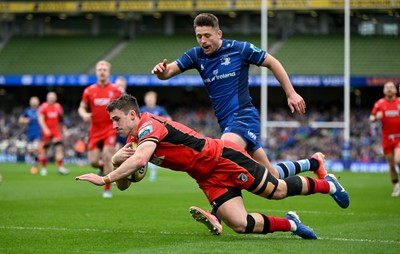 010325 - Leinster v Cardiff Rugby - United Rugby Championship - Harri Millard of Cardiff scores his side's first try despite the efforts of Ross Byrne of Leinster