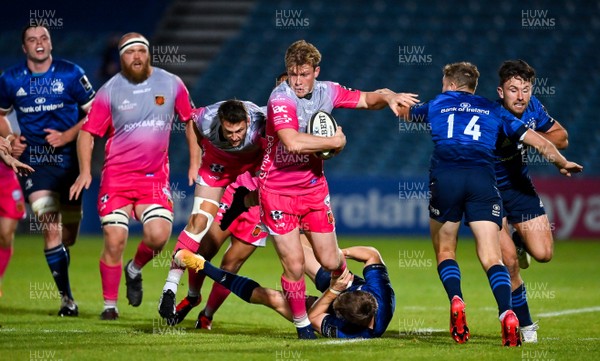 021020 - Leinster v Dragons - Guinness PRO14 - Nick Tompkins of Dragons is tackled by Garry Ringrose and Jordan Larmour of Leinster