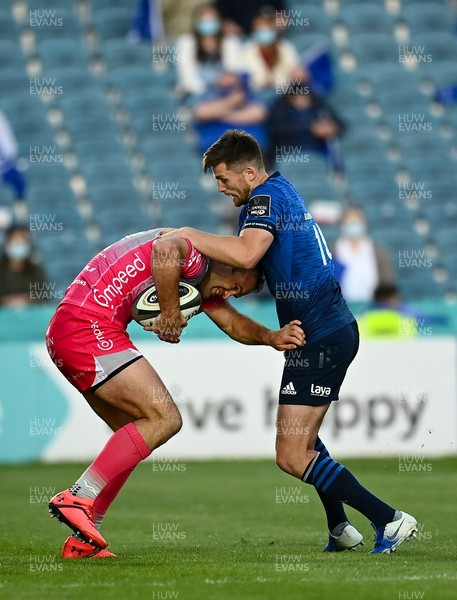 110621 - Leinster v Dragons - Guinness PRO14 Rainbow Cup - Jamie Roberts of Dragons is tackled by Ross Byrne of Leinster