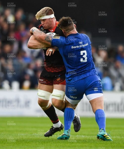 150918 - Leinster v Dragons - Guinness PRO14 -  Aaron Wainwright of Dragons is tackled by Andrew Porter of Leinster