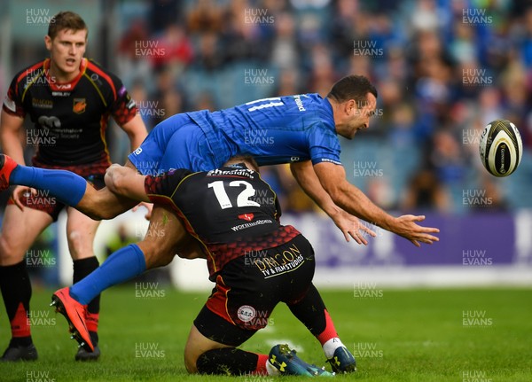 150918 - Leinster v Dragons - Guinness PRO14 -  Dave Kearney of Leinster is tackled by Jack Dixon of Dragons 