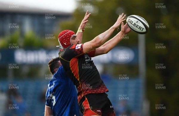 150918 - Leinster v Dragons - Guinness PRO14 -  Cory Hill of Dragons in action against James Ryan of Leinster 