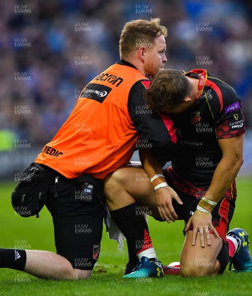 150918 - Leinster v Dragons - Guinness PRO14 -  Hallam Amos of Dragons is attended to by medical personnel after being injured