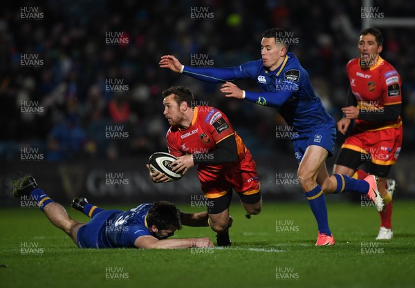 241117 - Leinster v Dragons - Guinness PRO14 -   Adam Warren of Dragons is tackled by Cathal Marsh, left and Noel Reid of Leinster