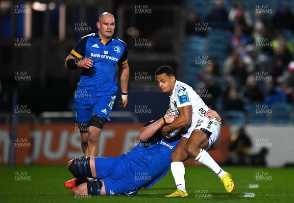 180223 - Leinster v Dragons RFC - United Rugby Championship - Ashton Hewitt of Dragons is tackled by Brian Deeny of Leinster