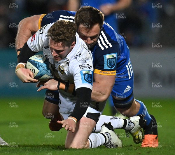 180223 - Leinster v Dragons RFC - United Rugby Championship - Angus O'Brien of Dragons is tackled by Jason Jenkins of Leinster
