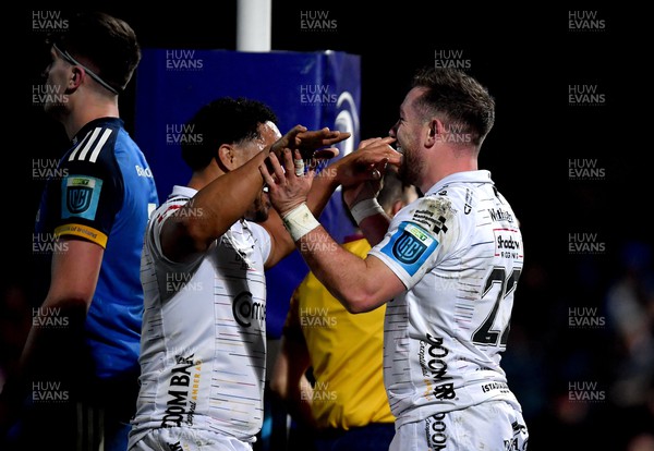 180223 - Leinster v Dragons RFC - United Rugby Championship - JJ Hanrahan of Dragons celebrates with teammate Aki Seiuli after scoring his side's second try
