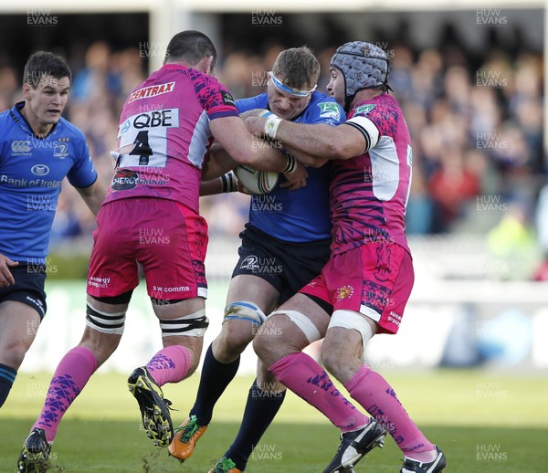 131012 Leinster v Exeter - Heineken Cup - Jamie Heaslip of Leinster is tackled by Tom Hayes and Richard Baxter of Exeter 