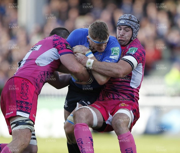 131012 Leinster v Exeter - Heineken Cup - Jamie Heaslip of Leinster is tackled by Tom Hayes and Richard Baxter of Exeter 