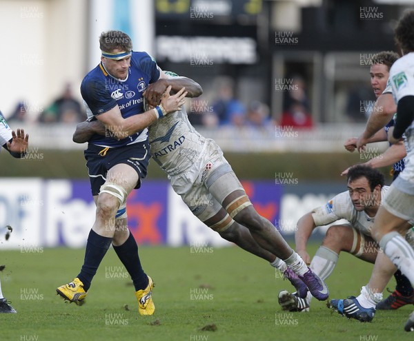 21.01.12 - Leinster v Montpellier - Heineken Cup Jamie Heaslip of Leinster tackled by Montpellier's Fulgence Ouedraogo 