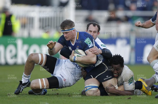 21.01.12 - Leinster v Montpellier - Heineken Cup Jamie Heaslip of Leinster tackled by Montpellier's Vasili Bost and Fulgence Ouedraogo 