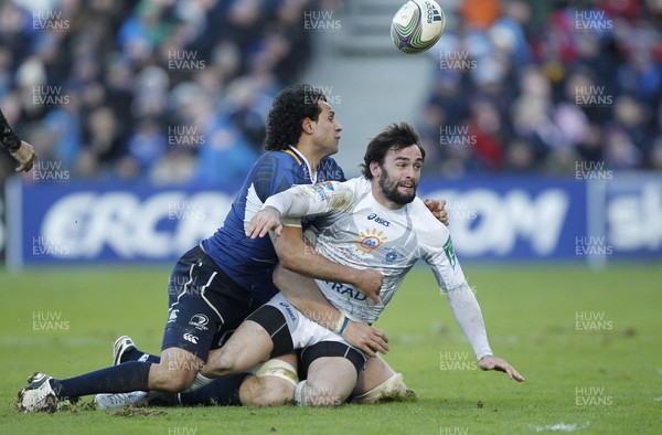 21.01.12 - Leinster v Montpellier - Heineken Cup Jean-Bapiste Peyras of Montpellier offloads despite the tackle of Leinster's Isa Nacewa 