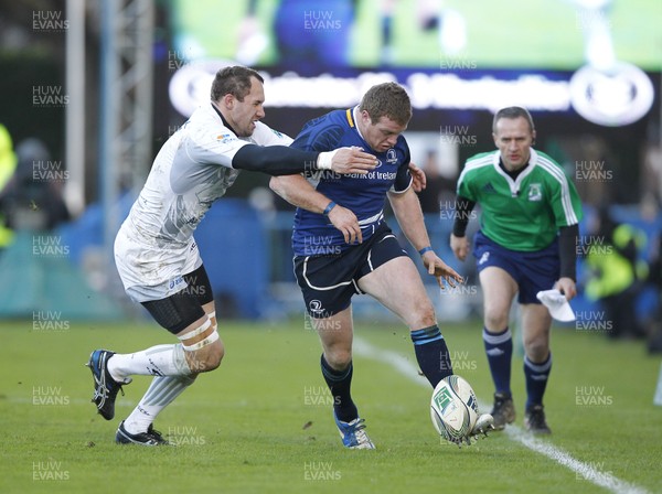 21.01.12 - Leinster v Montpellier - Heineken Cup Sean Cronin of Leinster kicks as Vasili Bost of Montpellier attempts the tackle 