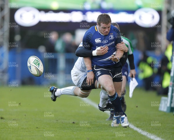 21.01.12 - Leinster v Montpellier - Heineken Cup Sean Cronin of Leinster kicks as Vasili Bost of Montpellier attempts the tackle 