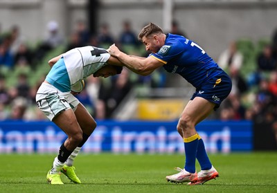 160526 - Leinster v Ospreys - United Rugby Championship - Keelan Giles of Ospreys is tackled by Jordan Larmour of Leinster