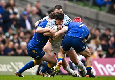 160526 - Leinster v Ospreys - United Rugby Championship - Owen Watkin of Ospreys is tackled by Leinster players Gus McCarthy and Josh van der Flier