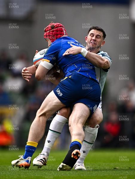 160526 - Leinster v Ospreys - United Rugby Championship - Josh van der Flier of Leinster is tackled by Owen Watkin of Ospreys