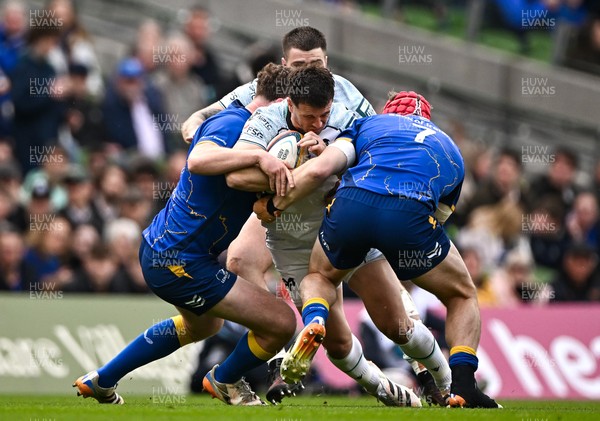160526 - Leinster v Ospreys - United Rugby Championship - Owen Watkin of Ospreys is tackled by Leinster players Gus McCarthy and Josh van der Flier
