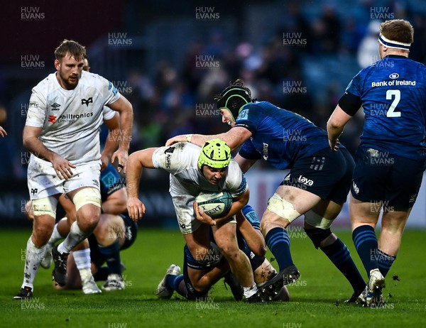 190222 - Leinster v Ospreys - United Rugby Championship - Harri Deaves of Ospreys is tackled by Ross Molony of Leinster