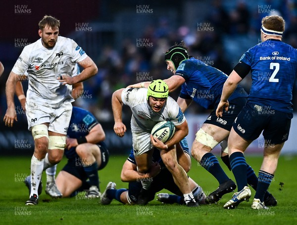 190222 - Leinster v Ospreys - United Rugby Championship - Harri Deaves of Ospreys is tackled by Ross Molony of Leinster