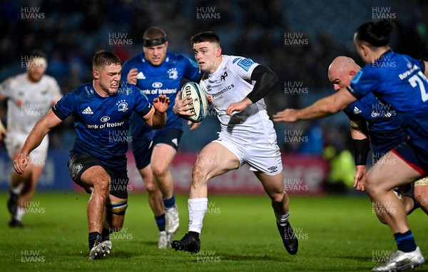 190222 - Leinster v Ospreys - United Rugby Championship - Reuben Morgan Williams of Ospreys in action against Scott Penny and Rhys Ruddock of Leinster