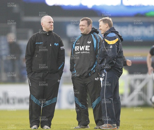 230312 Leinster v Ospreys - RaboDirect Pro 12 - Steve Tandy and Jonathan Humphreys of Ospreys greet Joe Schmidt of Leinster