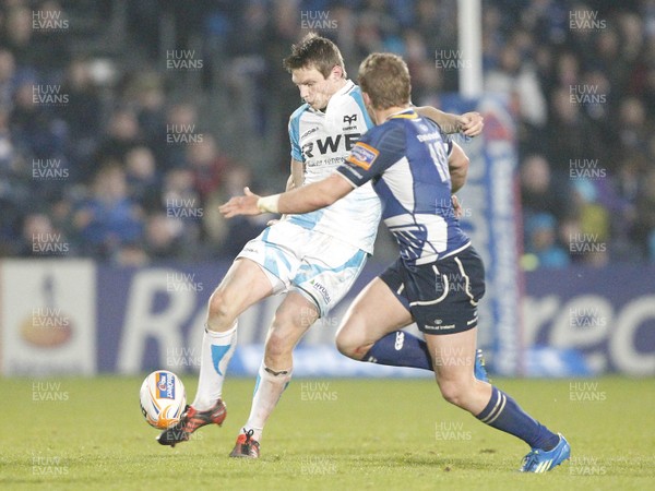 230312 Leinster v Ospreys - RaboDirect Pro 12 - Ospreys' Dan Biggar kicks past Ian Madigan of Leinster