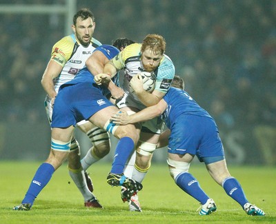 291114 - Leinster v Ospreys - Guinness Pro12 -   Dan Baker of Ospreys tackled by Kane Douglas and Bryan Byrne of Leinster(c) Huw Evans Agency