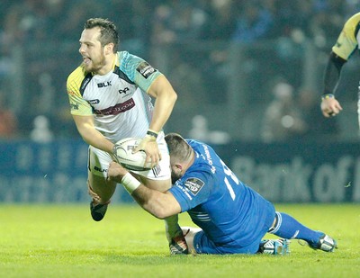 291114 - Leinster v Ospreys - Guinness Pro12 -   Dan Evans of Ospreys tackled by Jamie Hagan of Leinster (c) Huw Evans Agency