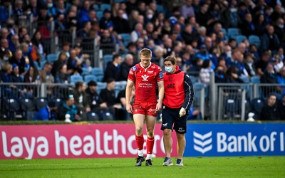 161021 - Leinster v Scarlets - United Rugby Championship - Johnny McNicholl of Scarlets leaves the field following an injury