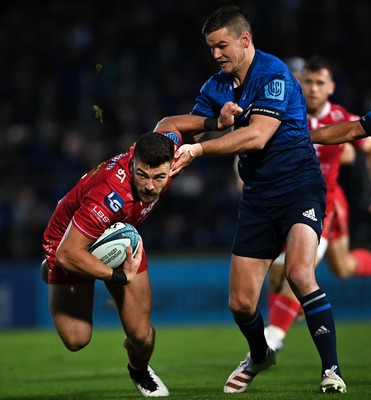 161021 - Leinster v Scarlets - United Rugby Championship - Johnny Williams of Scarlets is tackled by Jonathan Sexton of Leinster 