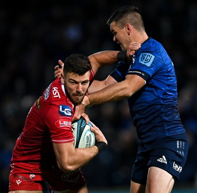 161021 - Leinster v Scarlets - United Rugby Championship - Johnny Williams of Scarlets is tackled by Jonathan Sexton of Leinster 