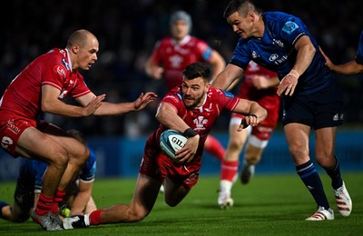 161021 - Leinster v Scarlets - United Rugby Championship - Johnny Williams of Scarlets is tackled by Jonathan Sexton of Leinster 