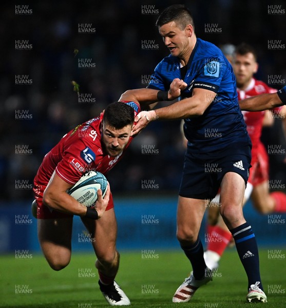 161021 - Leinster v Scarlets - United Rugby Championship - Johnny Williams of Scarlets is tackled by Jonathan Sexton of Leinster 