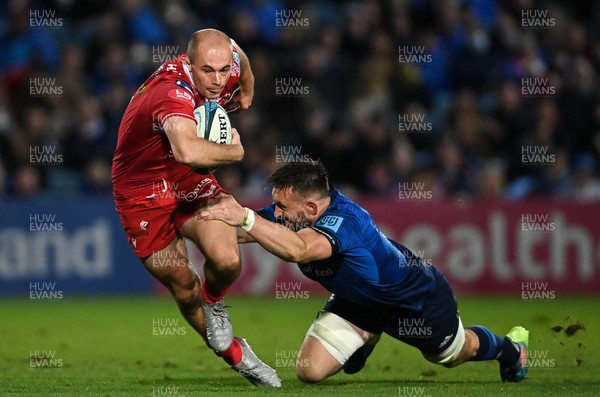 161021 - Leinster v Scarlets - United Rugby Championship - Ioan Nicholas of Scarlets is tackled by Jack Conan of Leinster